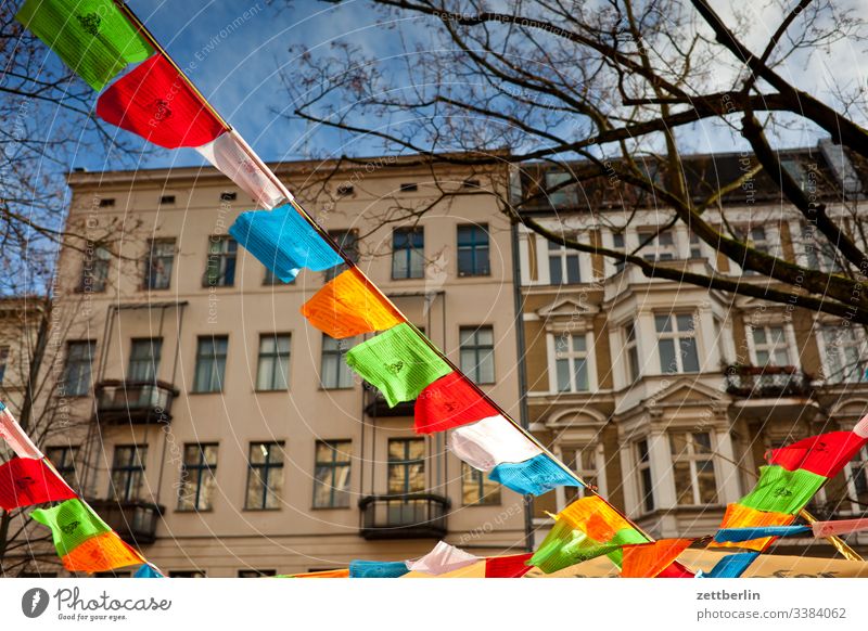 Prayer flags again berln Dalai Lama Flag prayer flag prayer pennant Back-light Deserted religion Schöneberg Sun Town Copy Space Tibet Blow Wind Street downtown