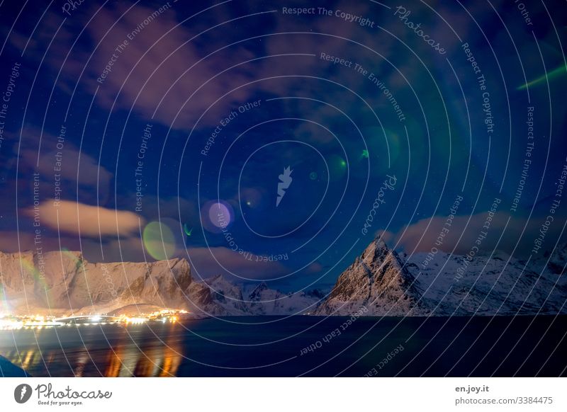 Reinefjorden at the blue hour with Mount Olstinden with Bokeh effect Colour Norway Lofotes Fjord mount olstinden ostineden Night sky Clouds reflection travel