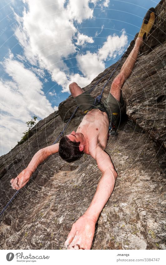 lifted | climber hangs upside down on rock face Sports Climbing Free climber Sky Clouds Perspective Inverted Irritation Safety Trust fun Joy Man Brave