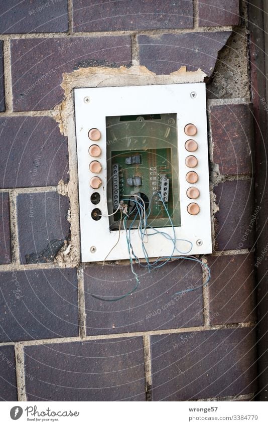 Neighbourhoods | what's left topic day neighbourhood bell shield bell button bell system broken Old loose wires Old building Deserted Colour photo