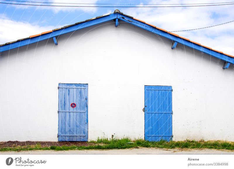 closed on the left, shut down on the right Hut Fishermans hut Closed too Oyster catcher Harbor buildings Boathouse White Blue France no parking sign Road sign