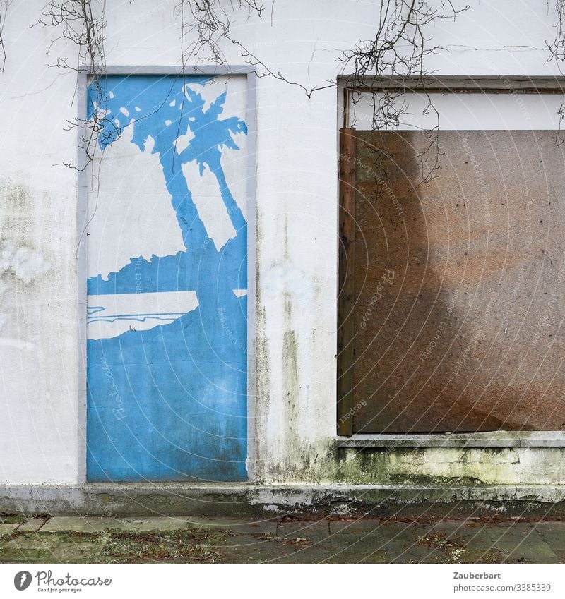 Facade with palm trees, windows, cardboard and branches House (Residential Structure) Window Door Palm tree Blue Brown locked dream Longing resignation Futile