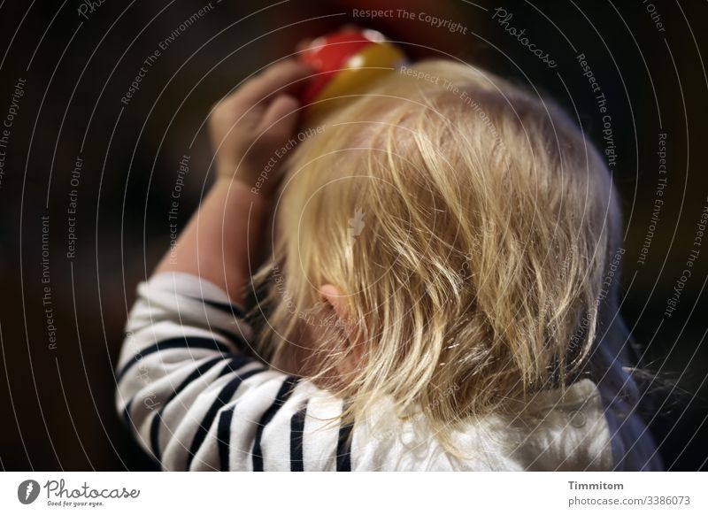 1900. Having fun and trying new things Toddler Hair and hairstyles Blonde girl Infancy Juggle juggling balls Head Playing Curiosity Joy