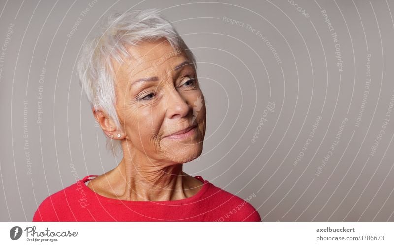 older woman looking pleased lady content mature senior adult smile smiling close-up closeup portrait headshot confident person best ager 60 sixties female