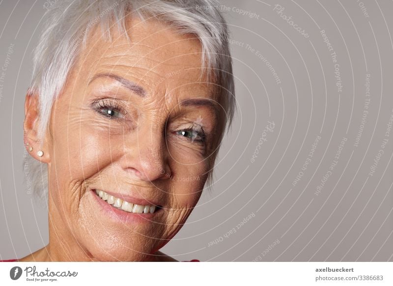 close-up senior woman with toothy smile smiling mature adult closeup portrait headshot confident happy lady content cheerful older person best ager 60 sixties