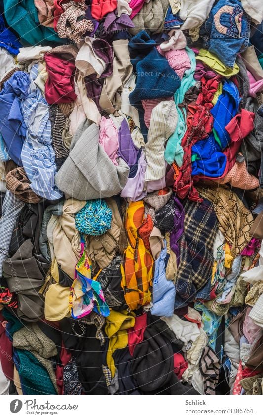 Bales of used textiles as background image Textiles Second-hand bale Second hand Many Textile industry recycling yard Recycling motley Clothing