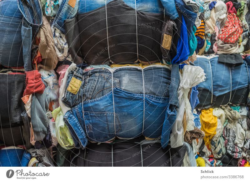 Bales of used textiles, especially jeans as background image Textiles Second-hand bale Second hand Many Textile industry recycling yard Recycling motley