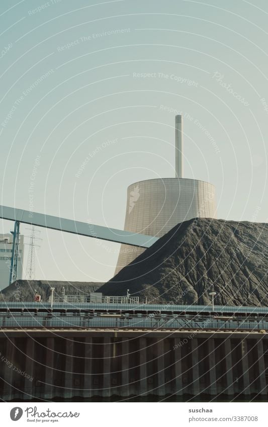 cooling tower with dirt mountain (seen from the river) Water tower Containers and vessels Industrial plant Manmade structures great Round Storehouse Industry