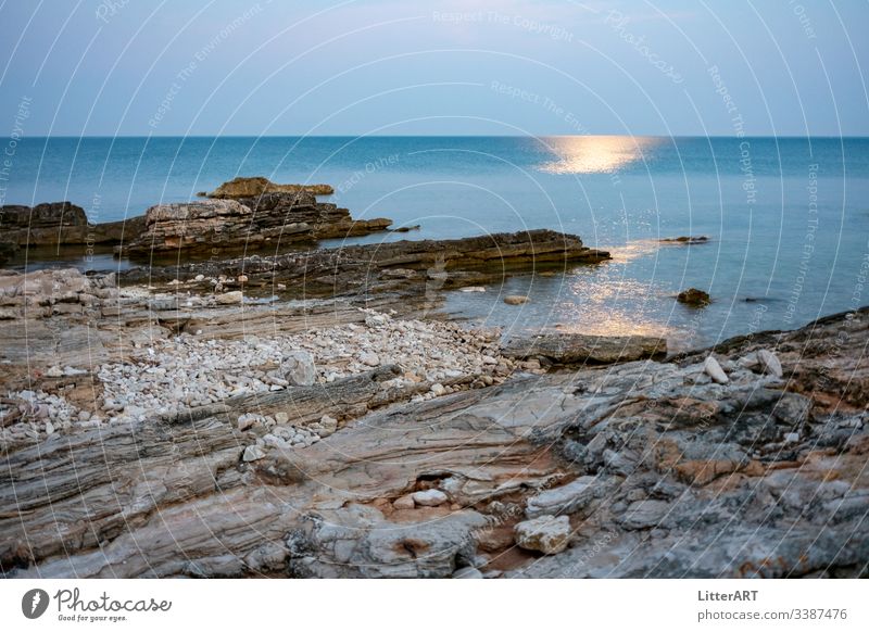 MOONRISE OVER THE DESERTED SEA Moon moon moonlight Twilight twilight reflection Ocean beach Coast Water rock Sky ocean Landscape Nature Blue coastline sunset