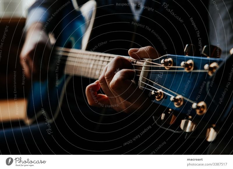 guitar Guitar Western guitar Guitarist Fretboard steel strings Blue hands Hand Man Grasp chords Close-up