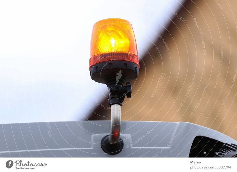 Orange flashing light on the transport on a blurred background orange abstract bright star bulb danger fire glowing illustration traffic white power decoration