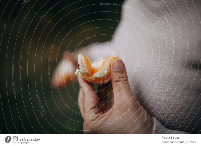 Closeup hand holding an orange Orange Hand Fingers Colour photo To hold on Exterior shot Fruit Food Fresh Healthy Organic produce Close-up Harvest