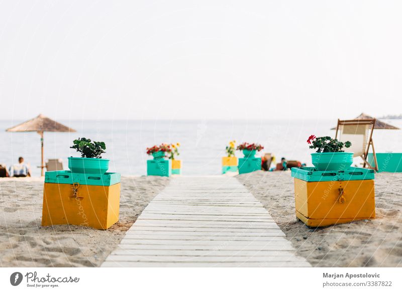 Beach entrance with a view on the sea beach beautiful beds coast coastline colorful decoration entry europe exotic furniture greece holiday horizon landscape