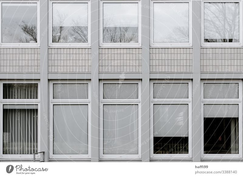 grey desolate façade Building Bad weather Facade Retro Cliche Gloomy Town Dark Venetian blinds Window Esthetic Old Roller blind Gray Modern Cold Hideous