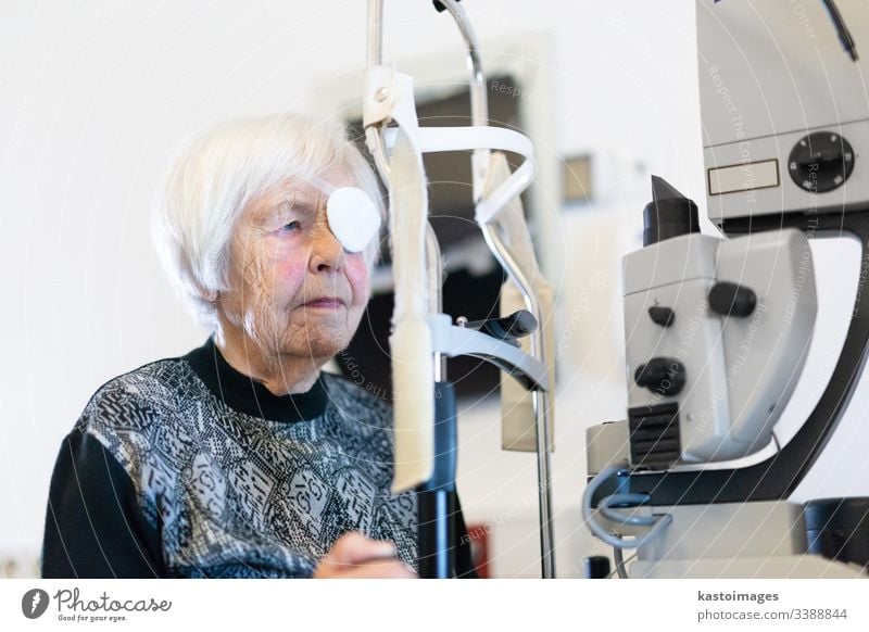 Senior woman wearing eye pathc after laser surgery procedure at ophthalmology clinic. sight senior optical vision female person beam eyepatch pensioner eld face