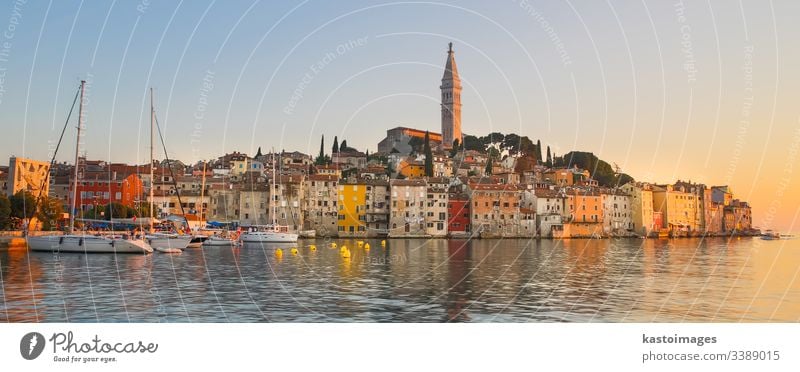 Colorful sunset of Rovinj town, Croatian fishing port on the west coast of the Istrian peninsula. rovinj croatia adriatic sea europe travel building destination