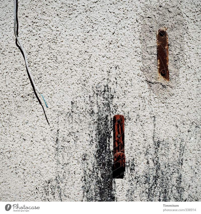 Wall decoration. Cable Wall (barrier) Wall (building) Checkmark Metal Plastic Gray Shadow Rust Plaster Tracks Colour photo Subdued colour Exterior shot Deserted