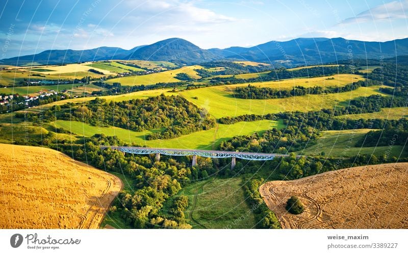 Aerial view of railway viaduct on the Tatra hills in Slovakia bridge mountain summer railroad aerial construction travel transportation panorama alpine Tatras