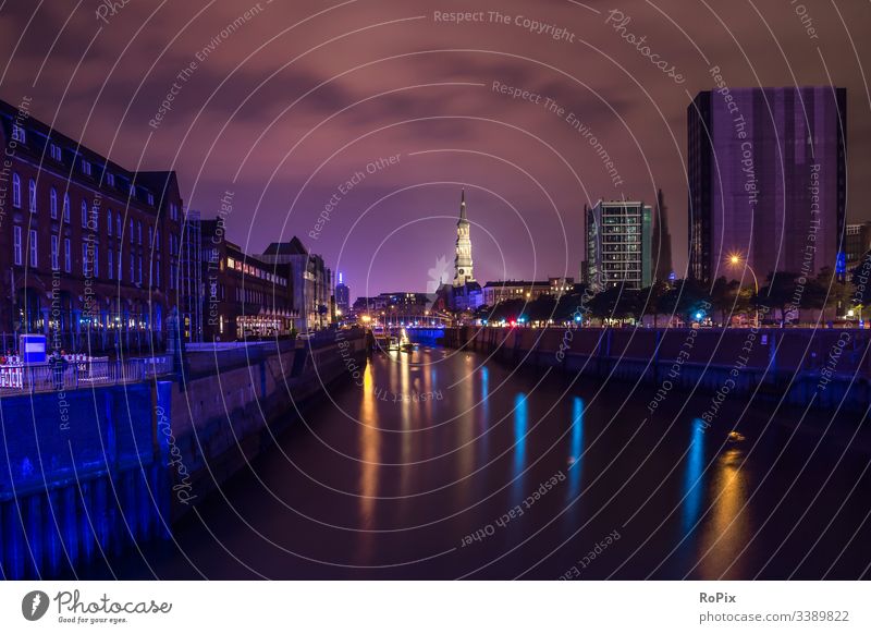 Historic harbor area of Hamburg. canal river Speicherstadt historic history harbour storehouse surface Hanse sightseeing cityscape landscape illuminated lights