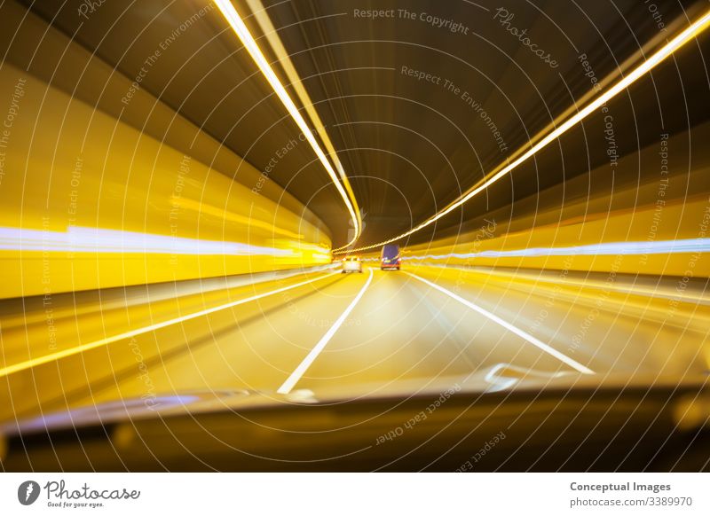 Car driving through tunnel road traffic night urban city highway transportation cityscape car speed travel motion dark fast evening modern movement busy