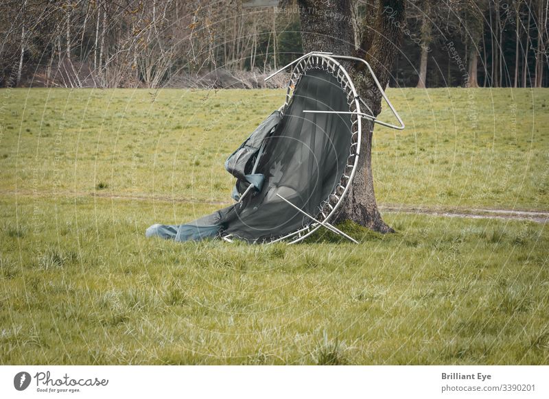 Damage to the trampoline due to a hurricane that was stopped by a tree Strong peril Disaster windy Safety Weather Trampoline Destruction Toys Broken Storm