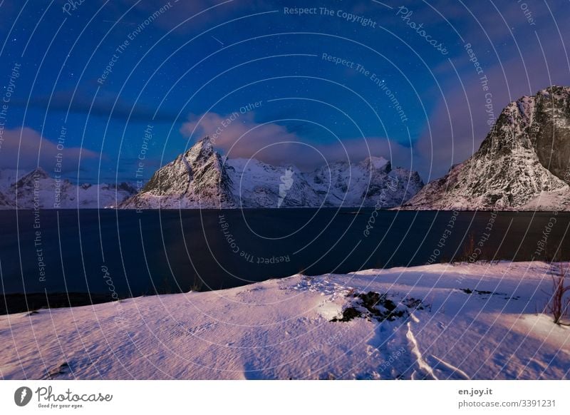 Reinefjorden at the blue hour with Mount Olstinden and snow Colour Norway Lofotes Fjord mount olstinden Night sky Clouds reflection travel Travel photography