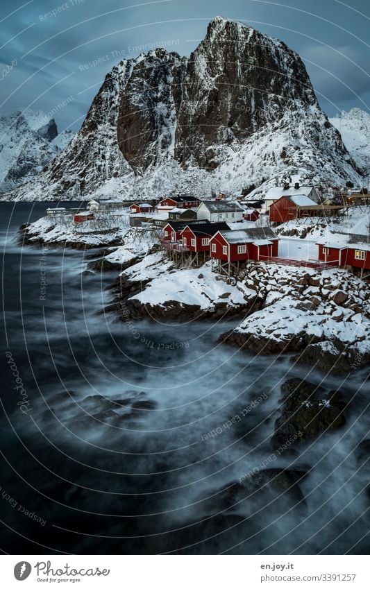 1.300 |fishing huts on the fjord in front of snowy mountains Vacation & Travel Trip Winter Snow Winter vacation Environment Landscape Sky Clouds Ice Frost