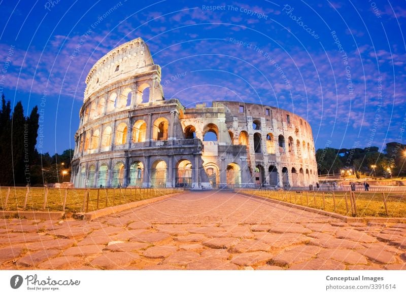 The Colosseum illuminated at dusk amphitheater ancient archeology architecture arena cityscape coliseum colosseum culture destination empire europe european