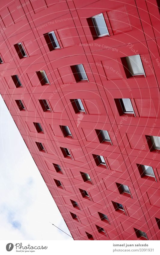 window on the red facade of the house, architecture in Bilbao city Spain building exterior home street outdoors color colorful structure construction wall