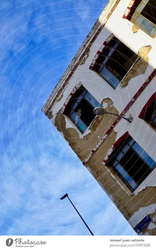 window on the old house, architecture in Bilbao city Spain white facade building exterior balcony home street outdoors color colorful structure construction