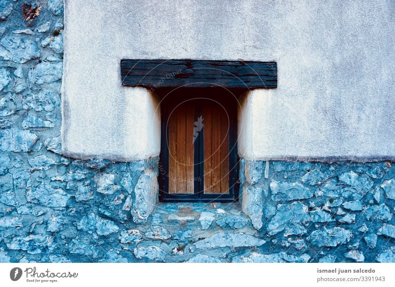 wooden window on the wall of the house white facade building exterior balcony home street city outdoors color colorful structure architecture construction