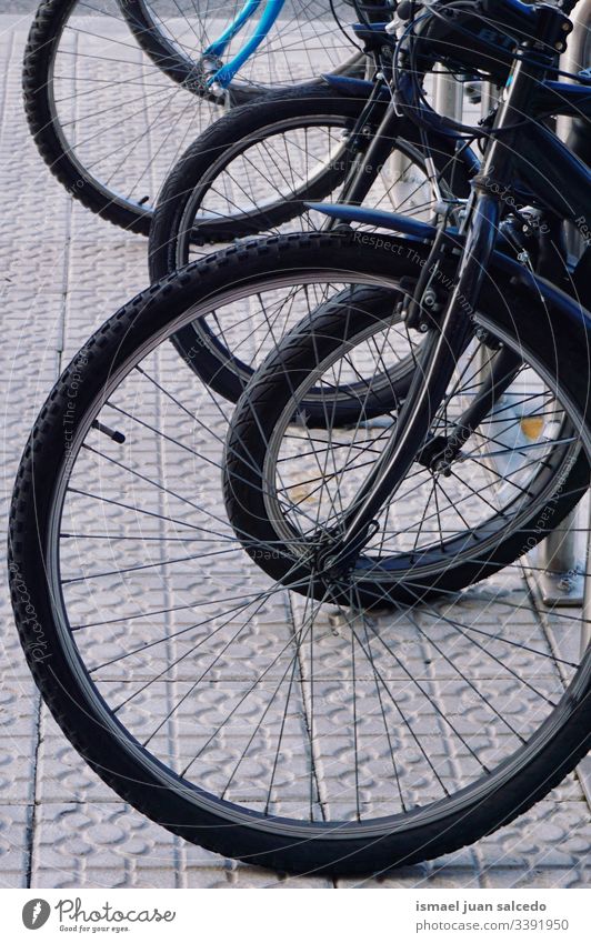 wheels of the bike on the street, mode of transport in Bilbao city Spain bicycle transportation cycling object hobby metal metallic outdoors old background