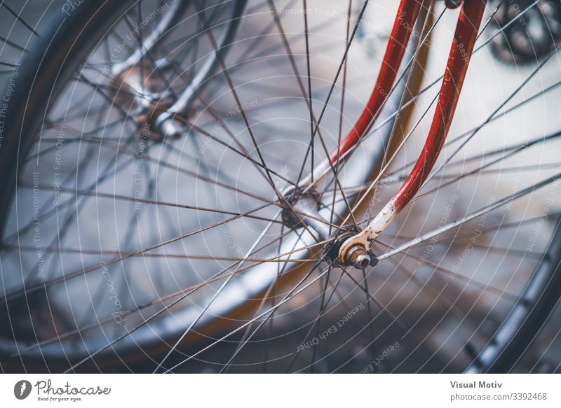 Front wheels, spokes and forks of a couple vintage bicycles color exterior outdoor outdoors front wheels nobody no people close up closeup close-up urban city