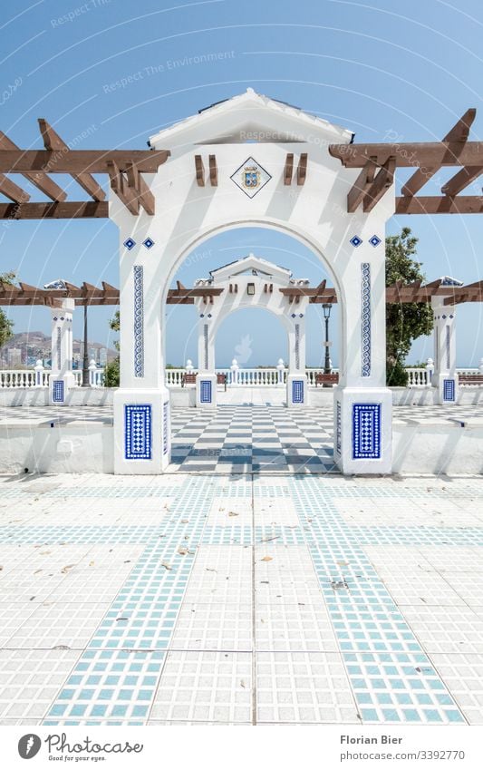 Public square in the south with archway and mosaic decorations Mosaic Goal Archway Wood graphically public square Pattern Town outlook Tourist urban Europe