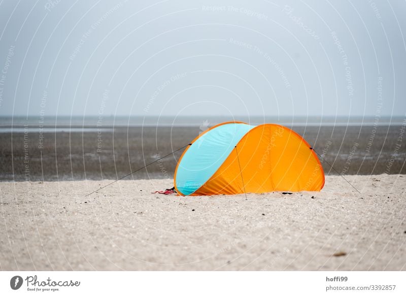 closed beach shell / tent at the sandy beach wind deflector Tent Ocean Beach Island Tourism Vacation & Travel Relaxation North Sea vacation Coast Sand beach toy