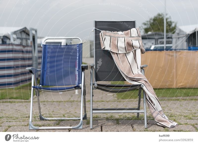 two abandoned camping chairs with towel Chair minimalism Minimalistic Deserted chirpy Muddled antagonism Seating In pairs Sadness Idyll Romance