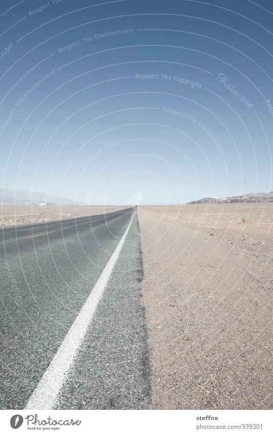 A long way to home Cloudless sky Summer Beautiful weather Canyon Desert Death valley Nationalpark USA Street Hot Effort Freedom Far-off places Infinity Dry