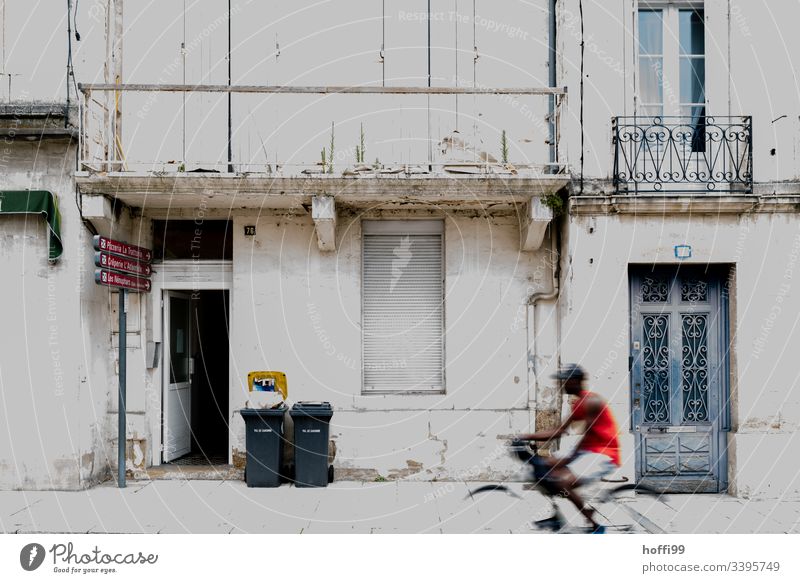 Old town facade with racing bike garbage cans and balconies Building Broken Wall (barrier) Roller shutter Racing cycle rubbish bin Waste collector off Facade