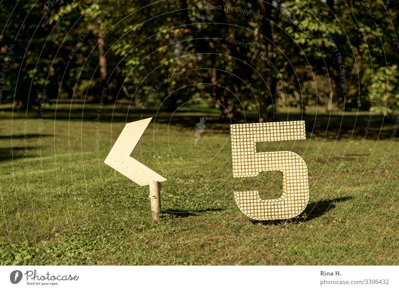 Five ( Signpost) Digits and numbers five Signage Green space Yellow Road marking