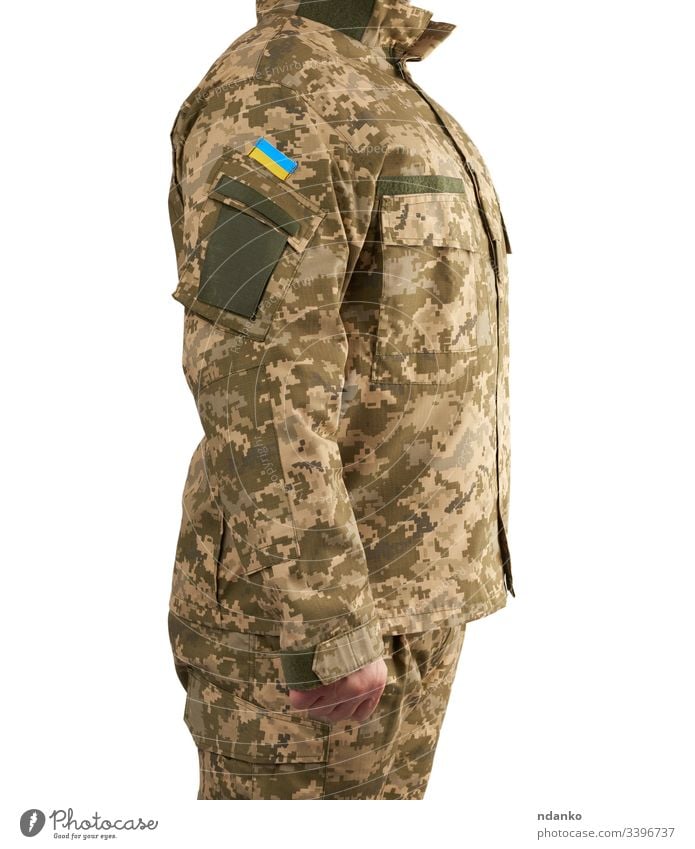 Ukrainian man warrior dressed in a military pixel uniform stands on a white isolated background flag ukraine ukrainian soldier army camouflage force male combat