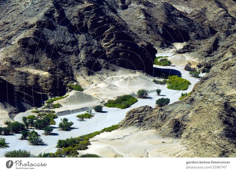 #Namibia: Oasis in the desert Rock of sandstone Fine sand in the valley sparse fauna Bushes little colour Bird's-eye view Light and shadow Summer Exterior shot