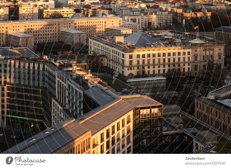 View of Leipziger Platz and the Berlin House of Representatives in the golden evening sun Town City centre Downtown Capital city Evening Evening sun houses