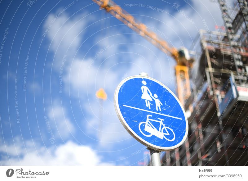 Traffic sign footpath cycle path in front of blurred crane on construction site Road sign Transport Cycle path Pedestrian Road traffic Traffic infrastructure