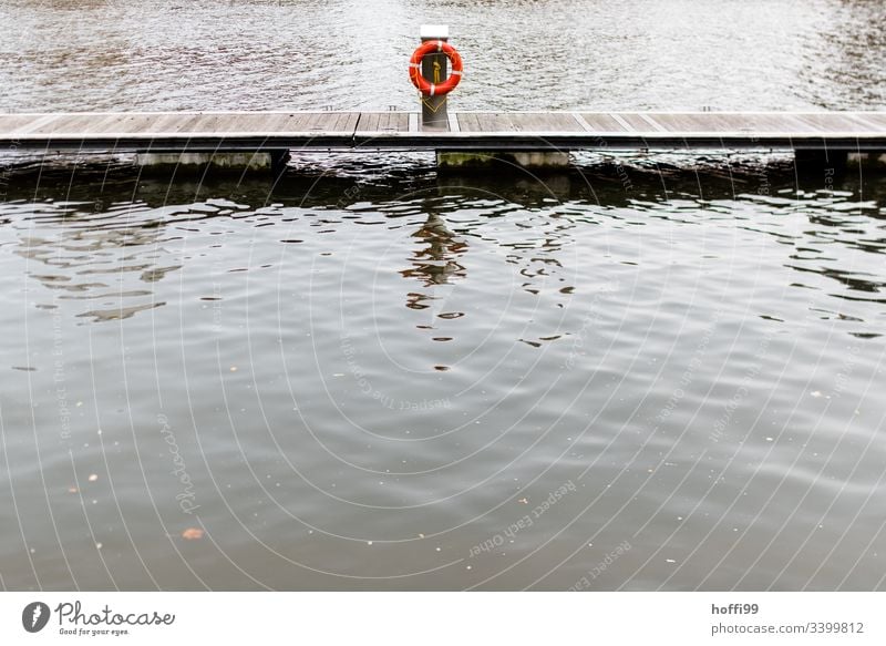 Life belt on jetty at landing stage Footbridge Jetty Water Lake Wood Watercraft Nature Harbour Calm Coast Moody Morning Reflection Maritime Surface of water