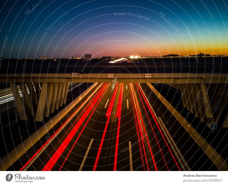 View of highway at sunset long background freeway movement travel headlight dark fast transport exposure red traffic car night motorway transportation motion