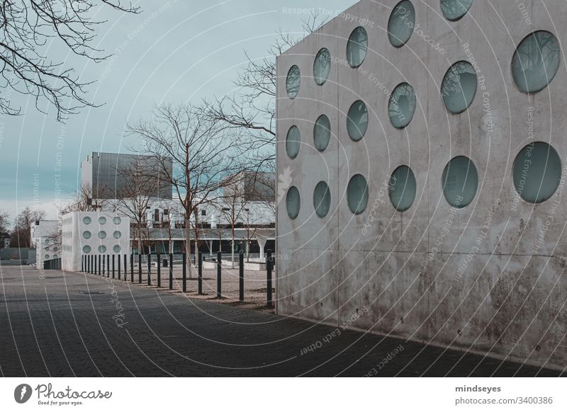 Portholes in the wall Darmstadt georg-büchner-platz Wall (barrier) urban Town Architecture surreal tree silhouettes Cold Winter Empty Places Room circles