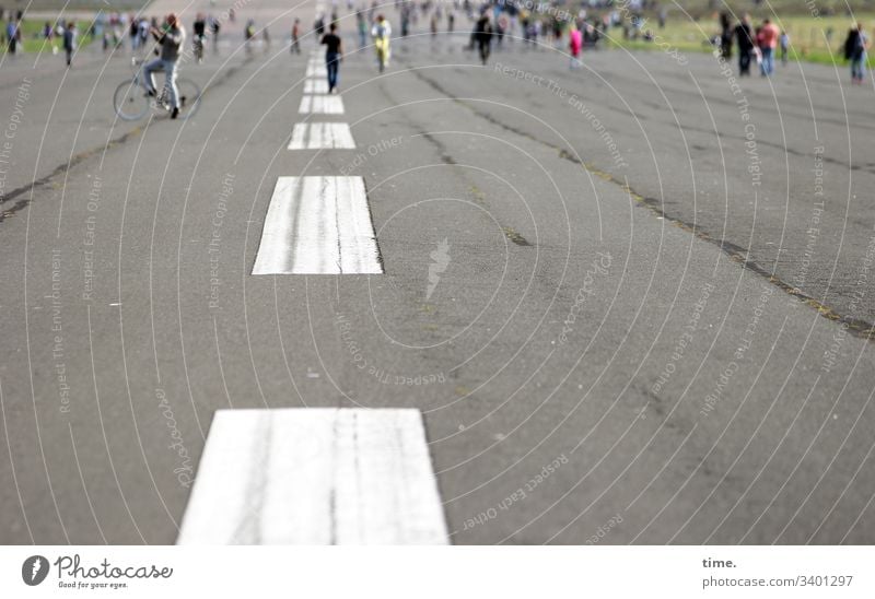 Pitches instead of runways Runway mark tempelhofer field people Bicycle Beautiful weather Asphalt Tar Colour wide Perspective In transit free time metamorphosis