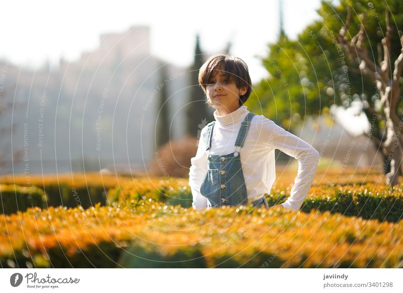 Eight-year-old girl having fun in an urban park one cheerful portrait cute child smile little person beauty childhood female schoolgirl outdoors daughter