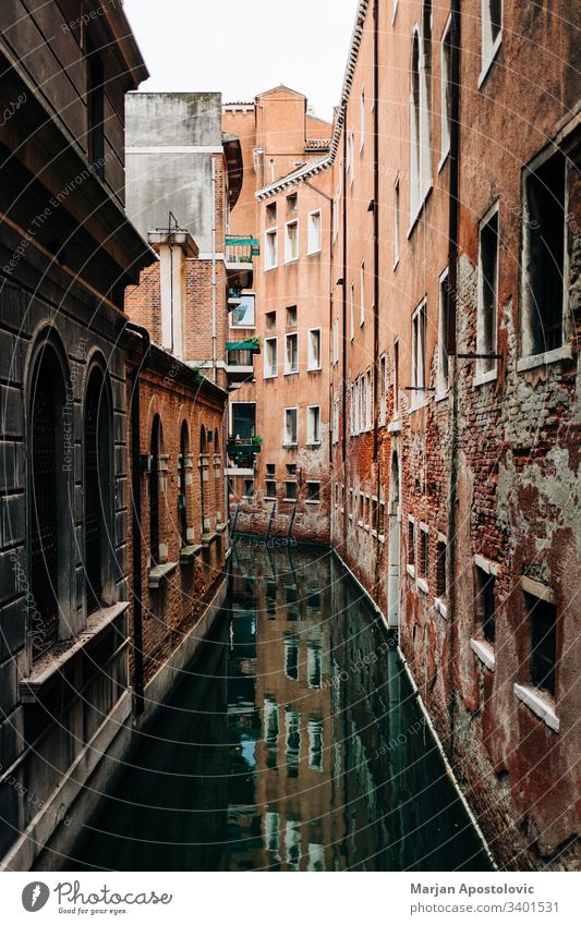 View of the rustic architecture of Venice, Italy canal alley alleyway ancient antique beautiful boat building city cityscape colorful destinations europe