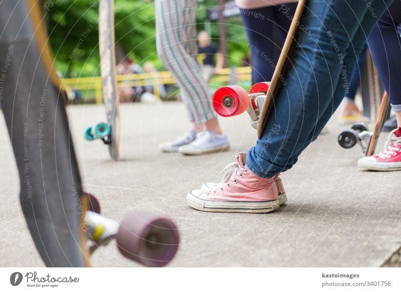 Teenagers practicing long board riding in skateboarding park. Active urban life. Urban subculture. sport one lifestyle fun skater girl youth young summer street